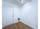 Laundry room with wood-look flooring and easy access to the back door at 6602 Winding Brook Dr, New Port Richey, FL 34655