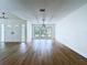 Bright living room features beautiful wood floors and plenty of natural light at 6602 Winding Brook Dr, New Port Richey, FL 34655