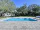 Private in-ground pool surrounded by a spacious patio, perfect for entertaining at 6602 Winding Brook Dr, New Port Richey, FL 34655