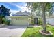 Charming single-story home with a well-maintained lawn and a two-car garage at 6628 Summer Haven Dr, Riverview, FL 33578