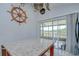 Bright kitchen featuring an island with granite countertop and sliding glass doors opening to the outside at 6628 Summer Haven Dr, Riverview, FL 33578