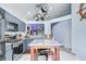 Modern kitchen with gray cabinets, granite countertops, stainless steel appliances, and an island at 6628 Summer Haven Dr, Riverview, FL 33578