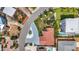 Birds-eye-view of property showcasing landscaping, driveway, nearby homes, and convenient street access at 7125 S Shore S Dr, St Petersburg, FL 33707