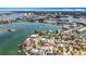Picturesque aerial view of waterfront homes with docks and boats in a scenic neighborhood at 7125 S Shore S Dr, St Petersburg, FL 33707