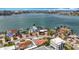 Expansive aerial view showcasing waterfront properties, with lush landscaping and tranquil bay at 7125 S Shore S Dr, St Petersburg, FL 33707