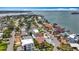 Wide aerial shot of neighborhood homes, showcasing mature trees and convenient access to water at 7125 S Shore S Dr, St Petersburg, FL 33707