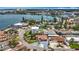 Panoramic aerial view of a waterfront community with lush landscaping and city skyline in the background at 7125 S Shore S Dr, St Petersburg, FL 33707
