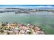 Stunning aerial view showcasing waterfront homes and a picturesque coastline at 7125 S Shore S Dr, St Petersburg, FL 33707