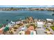 Stunning aerial view of waterfront homes, showcasing lush landscaping and beautiful bay views at 7125 S Shore S Dr, St Petersburg, FL 33707