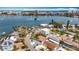 Wide aerial shot of waterfront neighborhood showcasing various architectural styles, landscaping and the bay at 7125 S Shore S Dr, St Petersburg, FL 33707