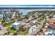 Aerial view showing waterfront neighborhood near bridge with houses and green space along bay inlet at 7125 S Shore S Dr, St Petersburg, FL 33707