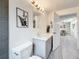 Stylishly updated bathroom with modern vanity, silver fixtures, and view into the hallway at 7125 S Shore S Dr, St Petersburg, FL 33707