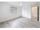 Bright, minimalist bedroom with ample closet space and a ceiling fan at 7125 S Shore S Dr, St Petersburg, FL 33707