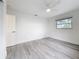 Bright bedroom with a window and a neutral color scheme at 7125 S Shore S Dr, St Petersburg, FL 33707