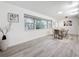 Bright dining room with a large window and modern decor at 7125 S Shore S Dr, St Petersburg, FL 33707