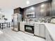 Stylish kitchen with stainless steel appliances and dark wood cabinets at 7125 S Shore S Dr, St Petersburg, FL 33707