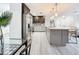Modern kitchen featuring an island, stainless steel appliances, and light wood flooring at 7125 S Shore S Dr, St Petersburg, FL 33707