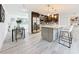 Bright kitchen featuring stainless steel appliances and a stylish dining area nearby at 7125 S Shore S Dr, St Petersburg, FL 33707