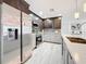 Spacious kitchen with stainless steel appliances and island, showcasing modern design at 7125 S Shore S Dr, St Petersburg, FL 33707