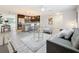 Cozy living room with modern furnishings and an open layout leading to the kitchen at 7125 S Shore S Dr, St Petersburg, FL 33707