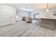Bright living room with an open floor plan, modern furniture and kitchen bar seating at 7125 S Shore S Dr, St Petersburg, FL 33707