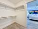 Well organized walk-in closet with wood-look floor, with access to the main bedroom at 7125 S Shore S Dr, St Petersburg, FL 33707