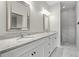 Elegant bathroom featuring double sinks, granite counters, and a walk-in shower at 807 Callista Cay Loop, Tarpon Springs, FL 34689