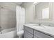 Cozy bathroom with shower-tub combo and gray vanity with granite countertop at 807 Callista Cay Loop, Tarpon Springs, FL 34689
