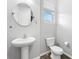 Cozy half bath with a pedestal sink and a window at 807 Callista Cay Loop, Tarpon Springs, FL 34689