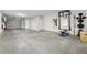 Large two car garage with workout area and plenty of storage at 807 Callista Cay Loop, Tarpon Springs, FL 34689