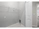 Functional laundry room with shelf, ready for appliances and storage solutions at 807 Callista Cay Loop, Tarpon Springs, FL 34689