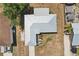 Aerial view showcasing the roof and well maintained yard of this inviting property at 953 Tropical Nw Ave, Port Charlotte, FL 33948