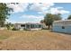 A spacious backyard is great for outdoor activities, along with a cozy sunroom and storage shed at 953 Tropical Nw Ave, Port Charlotte, FL 33948