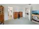 This bedroom features a bathroom, dresser, and television, offering a comfortable and relaxing atmosphere at 953 Tropical Nw Ave, Port Charlotte, FL 33948