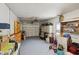 The well-lit garage has ample storage space and a garage door at 953 Tropical Nw Ave, Port Charlotte, FL 33948