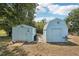 Backyard area featuring two storage sheds great for all your storage needs and tools at 953 Tropical Nw Ave, Port Charlotte, FL 33948