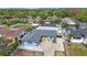 Aerial view of property showcasing the home, pool, and lush landscaping at 965 S Florida Ave, Tarpon Springs, FL 34689