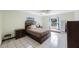 Bedroom with a comfortable bed, side tables, and a relaxing atmosphere at 965 S Florida Ave, Tarpon Springs, FL 34689