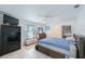 Bright bedroom with tile floors, neutral tones, and comfortable furnishings at 965 S Florida Ave, Tarpon Springs, FL 34689