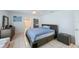 Clean bedroom with a comfortable bed, modern furniture, and ample natural light at 965 S Florida Ave, Tarpon Springs, FL 34689