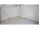 Empty bedroom with tiled floors, neutral paint, and a ceiling fan at 965 S Florida Ave, Tarpon Springs, FL 34689
