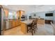 Modern kitchen with stainless steel appliances, granite countertops, and center island with seating at 965 S Florida Ave, Tarpon Springs, FL 34689