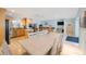 Open concept kitchen and dining area with a large island and modern appliances at 965 S Florida Ave, Tarpon Springs, FL 34689