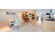 Open concept kitchen and dining area with a large island and modern appliances at 965 S Florida Ave, Tarpon Springs, FL 34689