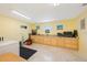 Spacious laundry room offering built in cabinets, tile flooring, and great lighting at 965 S Florida Ave, Tarpon Springs, FL 34689