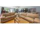 Comfortable living room with hardwood floors, sofas, and a game room area with pinball machines at 965 S Florida Ave, Tarpon Springs, FL 34689