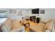 Cozy living room boasting hardwood floors, two sofas, and ample natural light at 965 S Florida Ave, Tarpon Springs, FL 34689
