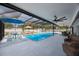 Inviting screened pool with ample seating for entertainment and leisure at 965 S Florida Ave, Tarpon Springs, FL 34689