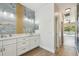 Modern bathroom featuring dual sinks, white cabinets, and beautiful blue marble backsplash at 9709 Bay Colony Dr, Riverview, FL 33578