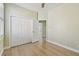 This is an empty bedroom with a door opening to another room at 9709 Bay Colony Dr, Riverview, FL 33578